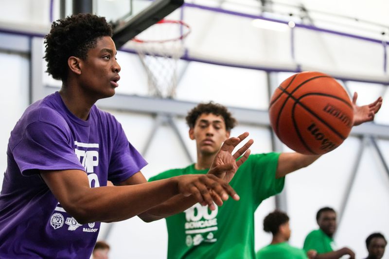 Pike’s Landon Lampley passes the ball in bounds Friday, June 12, 2026, during the 2026 Underclass Boys Basketball Showcase at Ben Davis High School in Indianapolis.