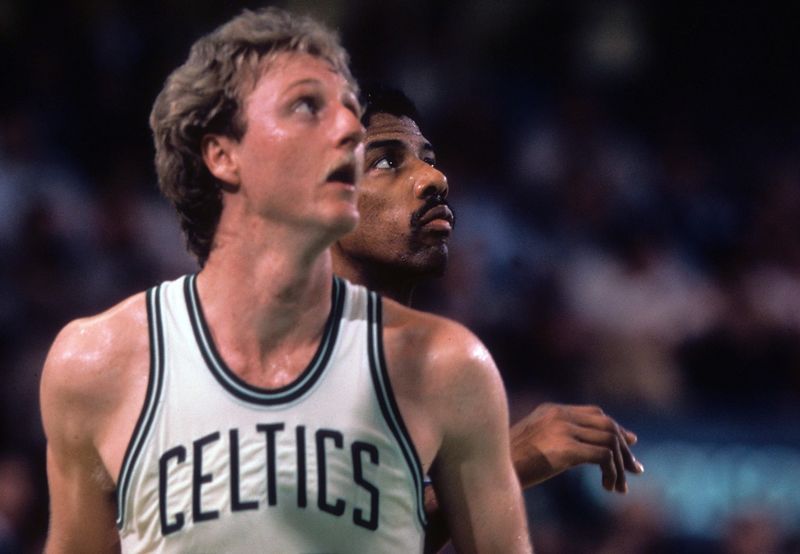 Unknown date; Boston, MA, USA; FILE PHOTO; Boston Celtics forward Larry Bird (33) and Philadelphia 76ers forward Julius Erving (back) battle for position at the Boston Garden. Mandatory Credit: Dick Raphael-USA TODAY Sports