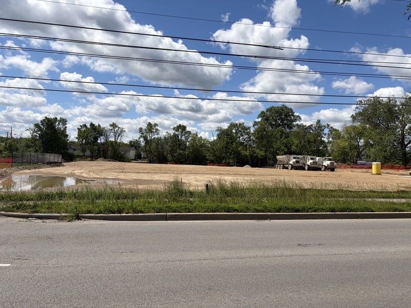 Construction trucks sit on a development site at 1621, 1625 and 1631 W. 86th St. in the St. Vincent Greenbriar neighborhood on June 15, 2026.