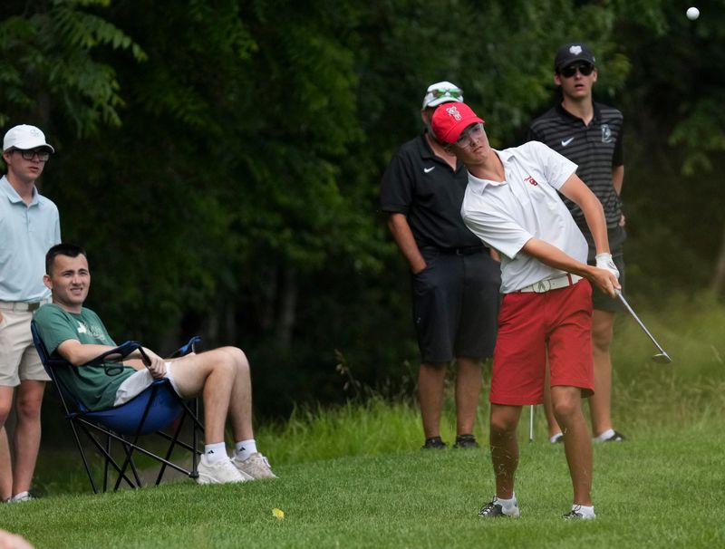 Center Grove’s Drew Carlson chips onto the 17th green during the first round of the IHSAA boy’s state finals on Tuesday, June 16, 2026, at Prairie View Golf Club
in Carmel.