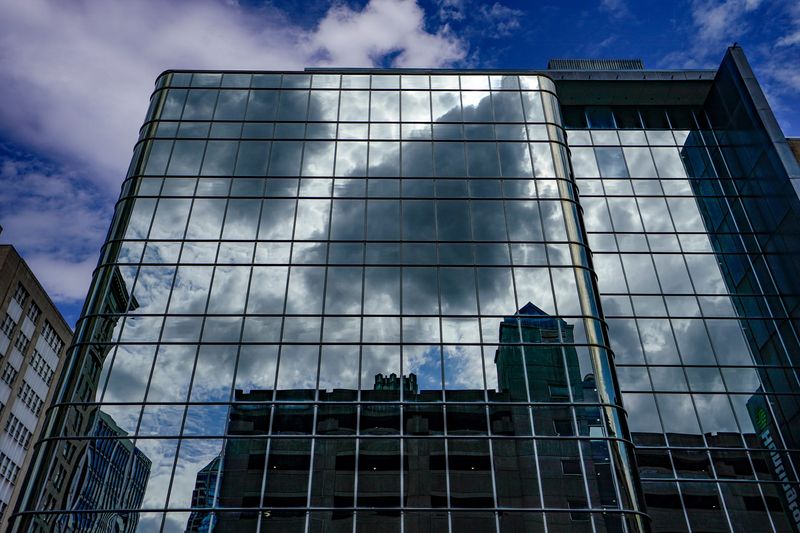 Clouds are reflected in a building on Tuesday, June 16, 2026, in Indianapolis.