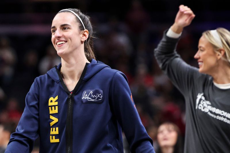 Indiana Fever guard Caitlin Clark (22) smiles while warming up Tuesday, June 16, 2026, before a game at Gainbridge Fieldhouse in Indianapolis.