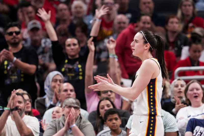 Indiana Fever guard Caitlin Clark (22) celebrates a play Tuesday, June 16, 2026, during the first half of a game at Gainbridge Fieldhouse in Indianapolis.