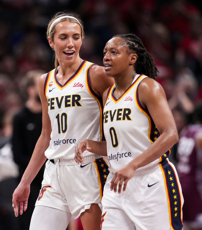 Indiana Fever guard Lexie Hull (10) and Indiana Fever guard Kelsey Mitchell (0) talk Tuesday, June 16, 2026, during the first half of a game at Gainbridge Fieldhouse in Indianapolis.