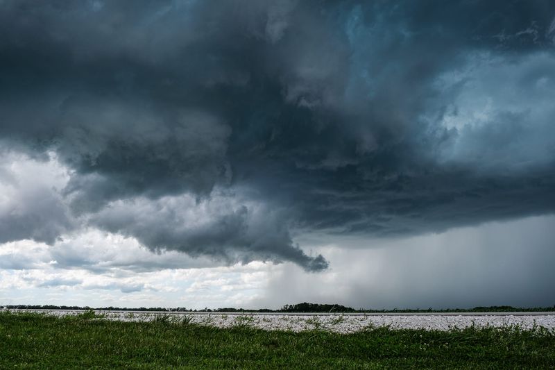 Dark, scudding clouds roll over the fields next to Indiana 26 outside Lafayette, Indiana, on June 16, 2026.