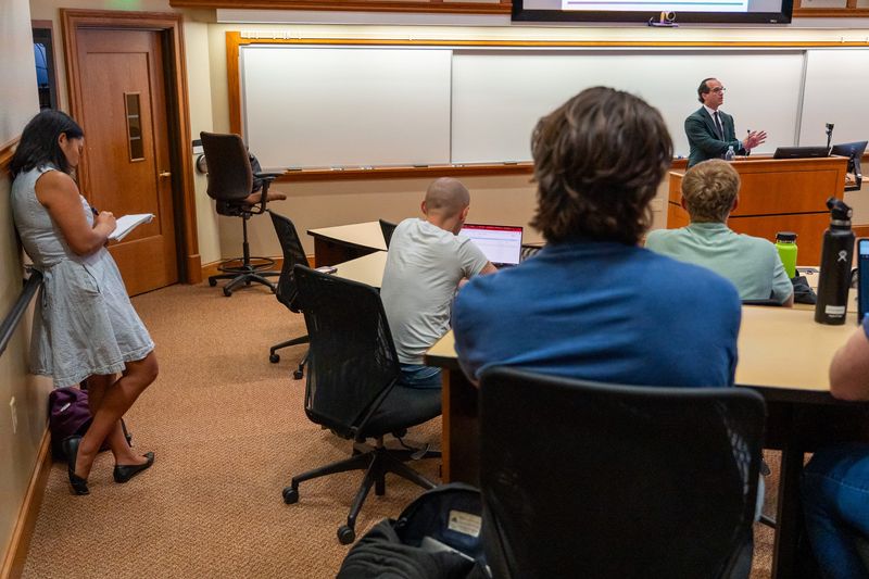 IndyStar investigative reporter Kristine Phillips takes notes Thursday, Aug. 29, 2024, as Elliot Slosar lectures in his University of Notre Dame classroom.