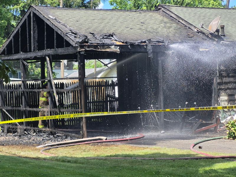 Firefighters put out hot spots remaining from a house fire in LaPorte where a LaPorte man was taken by a medical helicopter Thursday, June 18, 2026, to a trauma center.