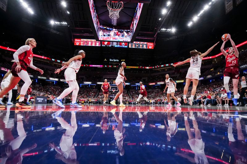 Indiana Fever guard Caitlin Clark (22) attempts a basket against Atlanta Dream guard Isobel Borlase (20) on Thursday, June 18, 2026, during a game at Gainbridge Fieldhouse in Indianapolis. The Atlanta Dream defeated the Indiana Fever, 108-101.