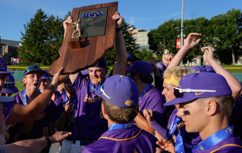 The Guerin Catholic Golden Eagles celebrate after receiving the trophy after winning the Class 3A State Finals game Friday, June 19, 2026, at Victory Field in Indianapolis.