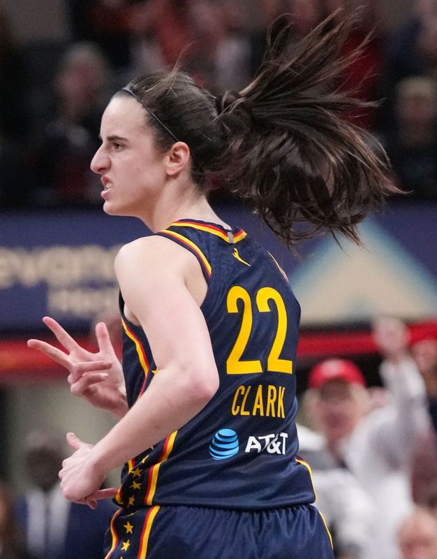 Indiana Fever guard Caitlin Clark (22) celebrates a three-point field goal on Monday, June 22, 2026, during the game at Gainbridge Fieldhouse in Indianapolis.