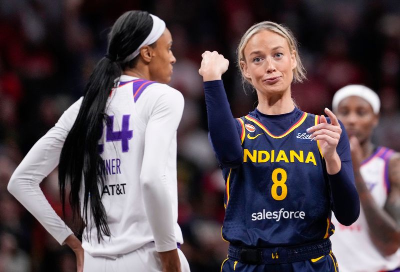 Indiana Fever guard Sophie Cunningham (8) points to Phoenix Mercury forward-guard DeWanna Bonner (24) after an argument between the two on Monday, June 22, 2026, during the game at Gainbridge Fieldhouse in Indianapolis. The Indiana Fever defeated the Phoenix Mercury, 86-77.