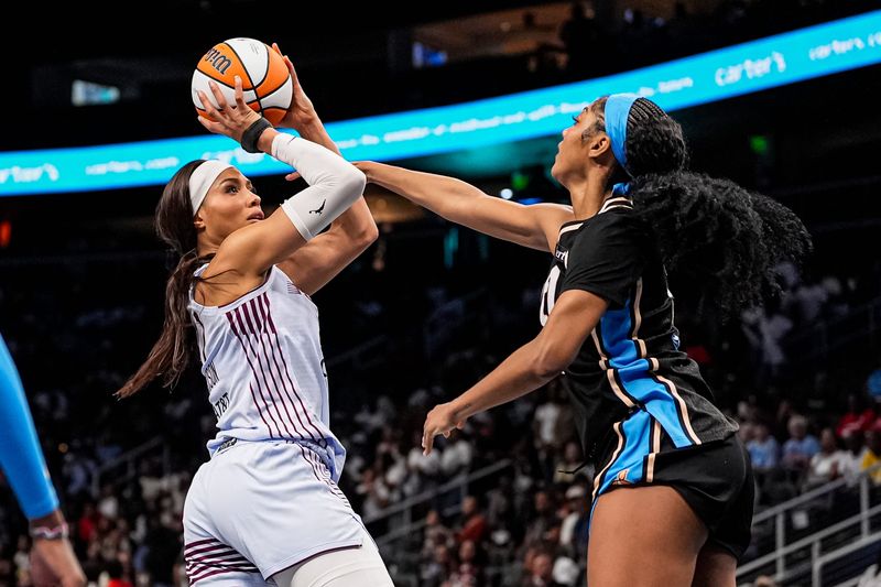 June 22, 2026; Atlanta, Georgia; Toronto Tempo forward Isabelle Harrison (21) shoots against Atlanta Dream forward Angel Reese (5) during the second half at State Farm Arena.