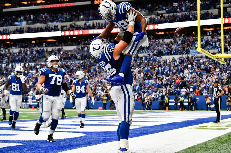 Indianapolis Colts running back Jonathan Taylor (28) and Indianapolis Colts guard Quenton Nelson (56) celebrate Taylor's touchdown late in the quarter at Lucas Oil Stadium Sunday, Oct. 31, 2021 in Indianapolis, Ind.

Titans Colts 128