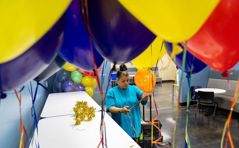 Jodi Bunton, owner of The Balloon Lady, prepares table centerpieces with balloons Thursday, May 7, 2026, at Community Life Center in Greenwood. Bunton is decorating for the "Big Night Out,” a highly anticipated event for people with special needs hosted by Mount Pleasant Christian Church.