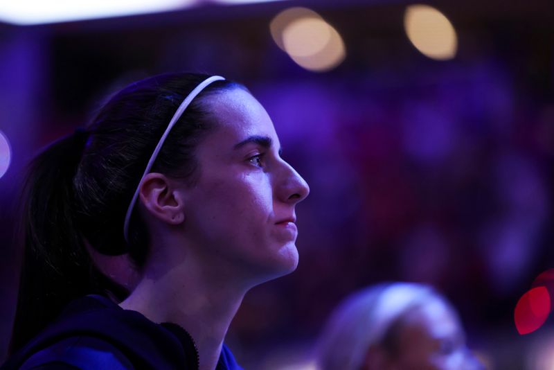 Indiana Fever guard Caitlin Clark (22) listens to the National Anthem on Wednesday, June 24, 2026, during the first half of a game at Gainbridge Fieldhouse in Indianapolis.