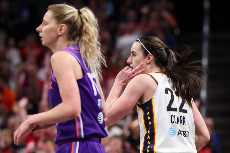 Indiana Fever guard Caitlin Clark (22) celebrates a 3-pointer Wednesday, June 24, 2026, during the first half of a game at Gainbridge Fieldhouse in Indianapolis.
