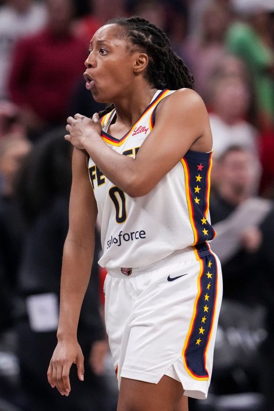 Indiana Fever guard Kelsey Mitchell (0) reacts to a call and fouling out of the game Wednesday, June 24, 2026, during the second half of a game at Gainbridge Fieldhouse in Indianapolis. The Phoenix Mercury defeated the Indiana Fever, 111-109.
