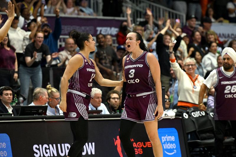 Jun 25, 2026; Toronto, Ontario, CAN; Toronto Tempo guard Marina Mabrey (3) is greeted by guard Kia Nurse (11) after making a basket against the Los Angeles Sparks in the second half at Coca-Cola Coliseum.