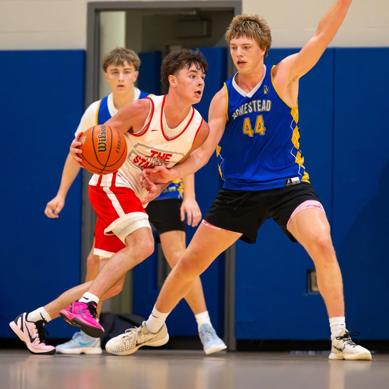 Fishers High School’s Cooper Zachary (4) works the ball around the court. Players compete during the 2026 IBCA/IHSAA Boys Team Showcase in Memory of Charlie Hughes at Carmel High School in Carmel, Ind., Saturday, June 27, 2026. The annual event brings together many of Indiana’s top high school boys basketball teams for a series of offseason showcase games while honoring the legacy of longtime basketball coach and educator Charlie Hughes, whose contributions to the sport helped shape generations of players and coaches throughout the state.
