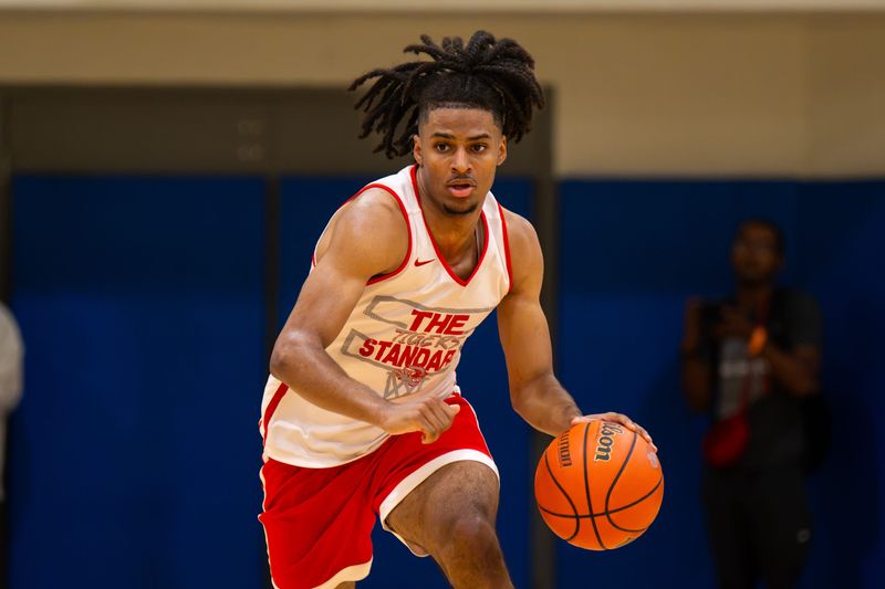 Fishers High School’s Jason Gardner (5) races up court with the ball. Players compete during the 2026 IBCA/IHSAA Boys Team Showcase in Memory of Charlie Hughes at Carmel High School in Carmel, Ind., Saturday, June 27, 2026. The annual event brings together many of Indiana’s top high school boys basketball teams for a series of offseason showcase games while honoring the legacy of longtime basketball coach and educator Charlie Hughes, whose contributions to the sport helped shape generations of players and coaches throughout the state.