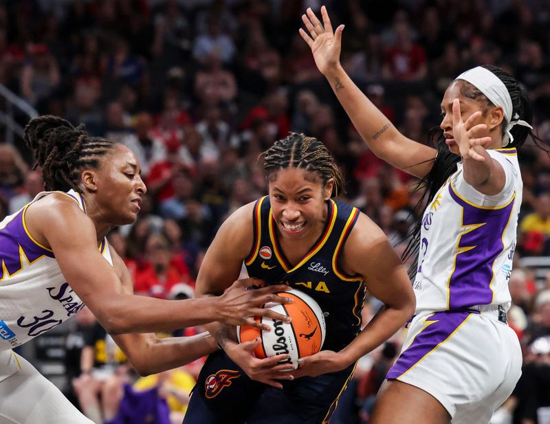 Los Angeles Sparks forward Nneka Ogwumike (30) and Los Angeles Sparks guard Chance Gray (2) guard Indiana Fever guard Tyasha Harris (52) on Saturday, June 27, 2026, during the second half of a game at Gainbridge Fieldhouse in Indianapolis. The Indiana Fever defeated the Los Angeles Sparks, 111-87.