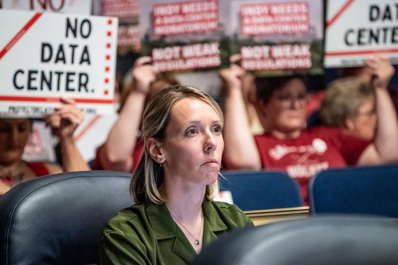 Megan Vukusich reads a proposal for data center regulations during a Indianapolis Metropolitan Development Commission meeting on Wednesday, July 1, 2026, at the City-County building in Indianapolis.