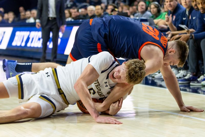 Jan 27, 2026; South Bend, Indiana, USA; Notre Dame Fighting Irish forward Brady Koehler (6) and Virginia Cavaliers forward Thijs de Ridder (28) fight for a loose ball during the second half at Purcell Pavilion at the Joyce Center. Mandatory Credit: Michael Caterina-Imagn Images