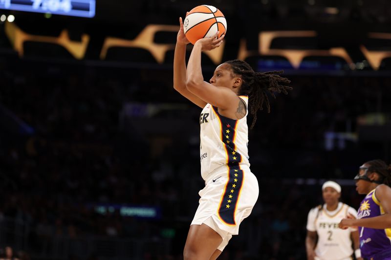 Jul 8, 2026; Los Angeles, California, USA;  Indiana Fever guard Kelsey Mitchell (0) shoots the ball during the first quarter against the Los Angeles Sparks at Crypto.com Arena. Mandatory Credit: Kiyoshi Mio-Imagn Images