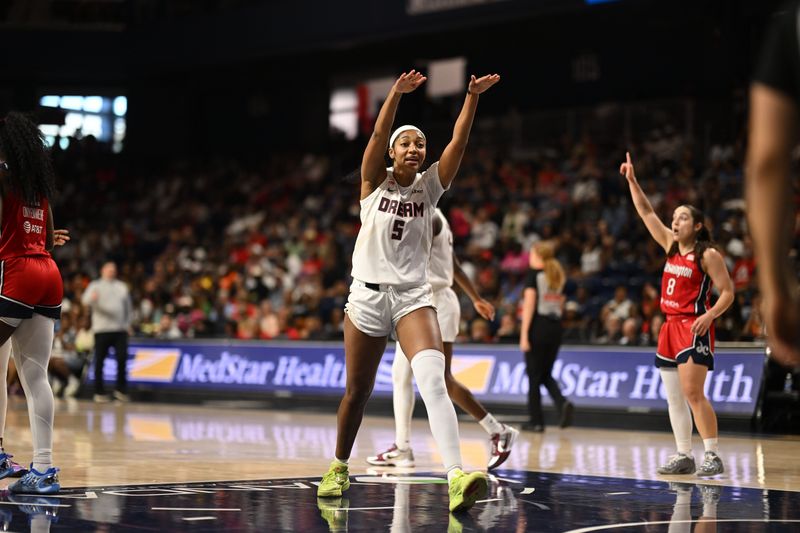 Jul 2, 2026; Washington, District of Columbia, USA; Atlanta Dream forward Angel Reese (5) gestures after a play against the Washington Mystics during the first quarter at CareFirst Arena. Mandatory Credit: Rafael Suanes-Imagn Images