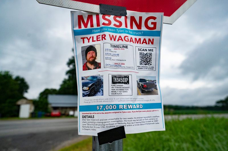 A missing poster for Tyler Wagaman, hangs on a stop sign along IN-67 on Saturday, July 11, 2026, in Gosport, Ind. Wagaman has been missing since mid June. Wagaman’s Verizon account had one ping in Gosport, according to his brother Brian Wagaman.
