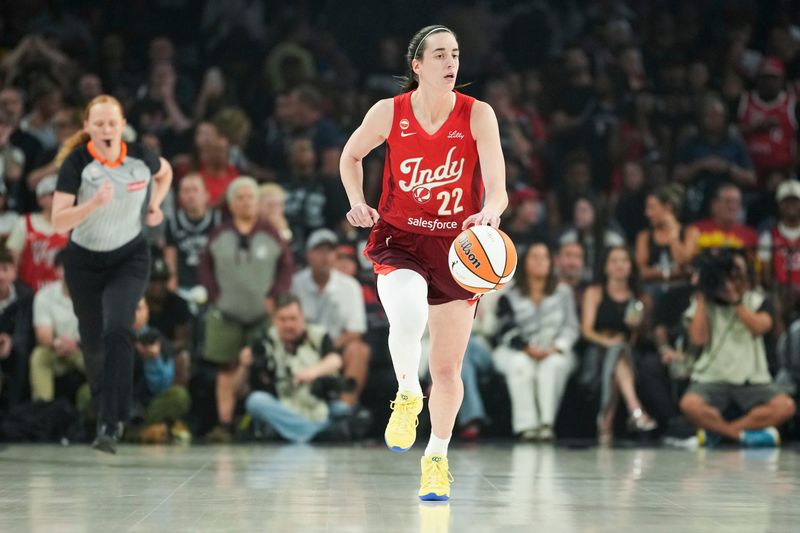 Jul 12, 2026; Las Vegas, Nevada, USA; Indiana Fever guard Caitlin Clark (22) dribbles the ball during the first quarter of a WNBA basketball game against the Las Vegas Aces at Michelob Ultra Arena. Mandatory Credit: Lucas Peltier-Imagn Images