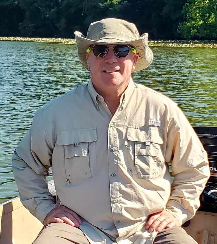 Curtis Skoog sits in a boat in Rockville, Indiana, almost 50 years after he and his father, Norman, found Chicago woman Jane Hart's body in their cornfield.