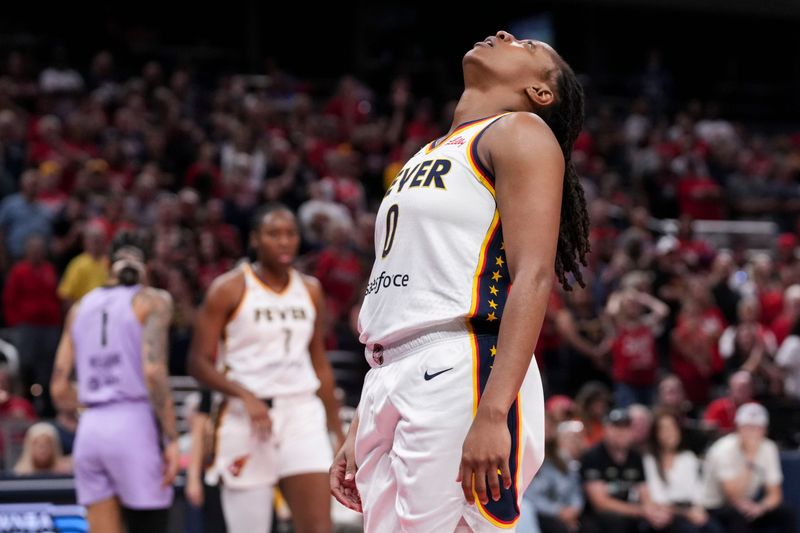 Indiana Fever guard Kelsey Mitchell (0) reacts to not grabbing the ball before it went out of bounds Wednesday, July 15, 2026, during the first half of a game at Gainbridge Fieldhouse in Indianapolis.