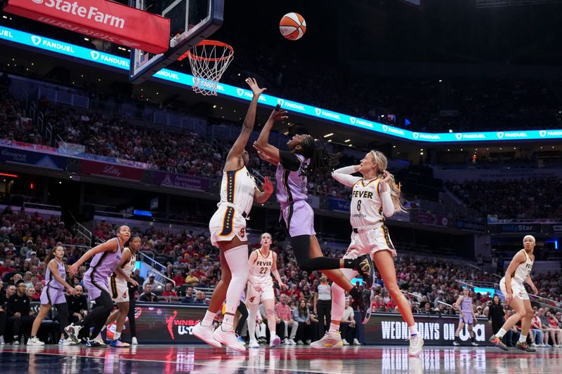 Golden State Valkyries guard Tiffany Hayes (15) goes up for a basket against Indiana Fever center Aliyah Boston (7) on Wednesday, July 15, 2026, during the first half of a game at Gainbridge Fieldhouse in Indianapolis.