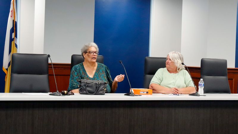 South Bend Community Police ReView Board member Cheryl Ashe (left) and secretary Sharon Banicki (right) sit in conversation at the board's July 16 meeting at South Bend City Council Chambers.