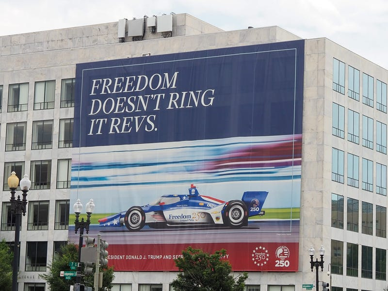 A banner promoting the Freedom 250 Grand Prix scheduled for August hangs on the Department of Transportation’s Orville Wright Federal Building at 800 Independence Ave. SW on June 22, 2026.