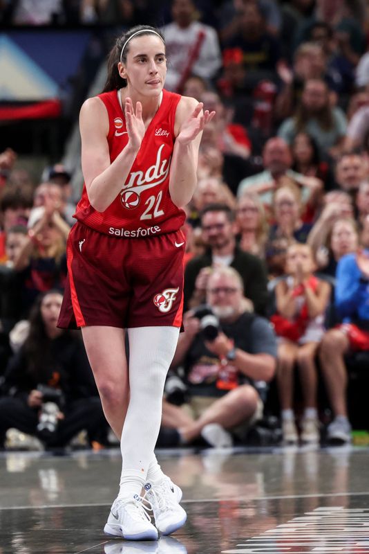 Indiana Fever guard Caitlin Clark (22) celebrates after scoring Friday, July 17, 2026, during the first half of a game at Gainbridge Fieldhouse in Indianapolis.