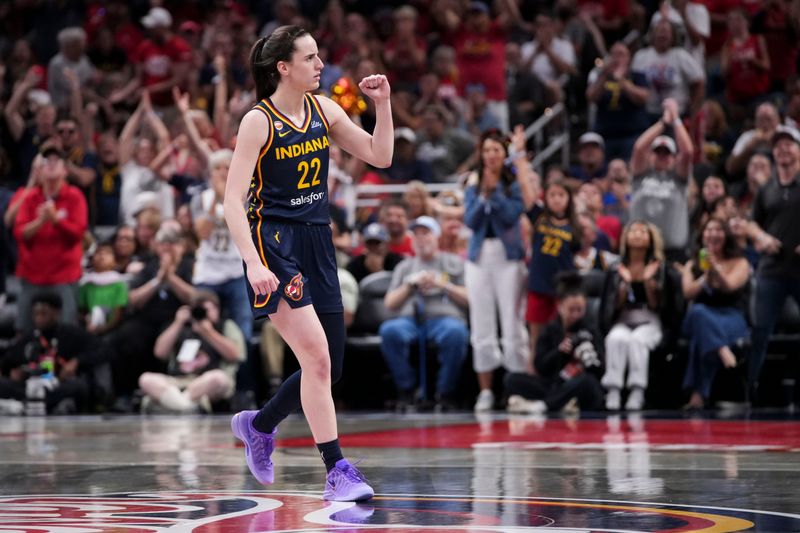 Indiana Fever guard Caitlin Clark (22) celebrates Saturday, July 18, 2026, during the second half of a game at Gainbridge Fieldhouse in Indianapolis. The Indiana Fever defeated the New York Liberty, 108-88.
