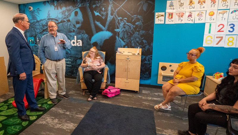 Executive Director of Shepherd Community Center, Jay Height introduces Indiana Governor Mike Braun to moms who rely on the Shepherd Community's Minnie Hartmann Neighborhood Childcare on Tuesday, July 21, 2026, in Indianapolis.