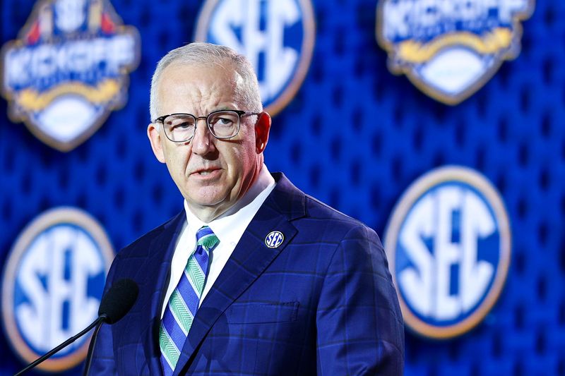 Jul 20, 2026; Tampa, FL, USA; SEC Commissioner Greg Sankey speaks to the press during SEC Football Kickoff Media Day at the Tampa Marriott. Mandatory Credit: Nathan Ray Seebeck-Imagn Images