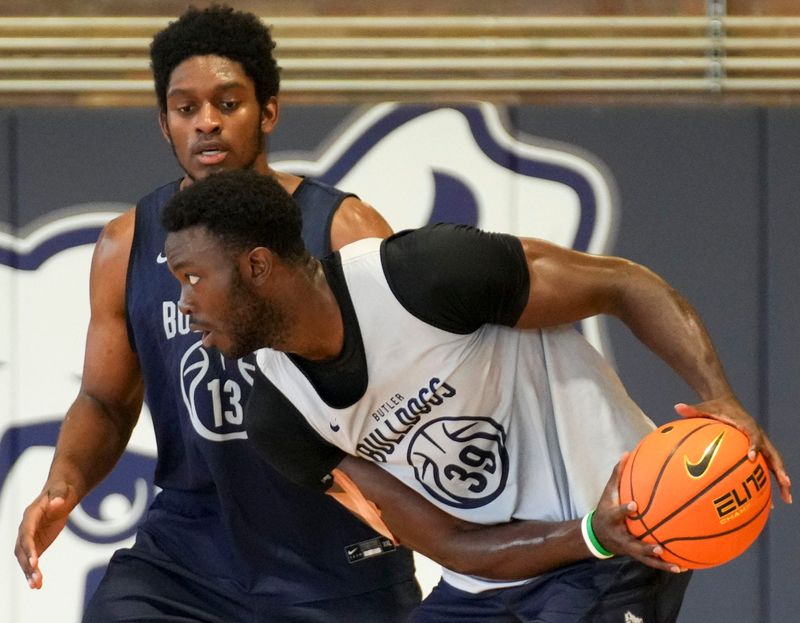 Butler Bulldogs center Drayton Jones (13) defends Butler Bulldogs center Kevin Ndzie (39) during summer practice Wednesday, July 22, 2026, at Hinkle Fieldhouse in Indianapolis.