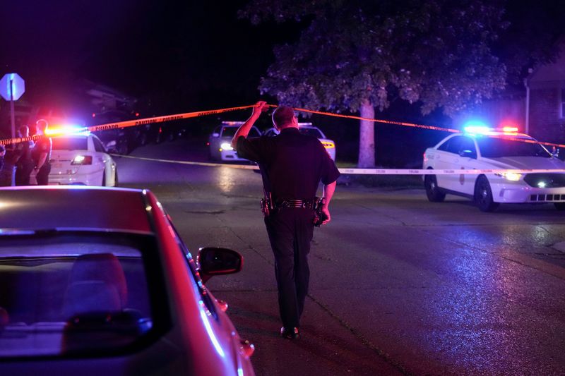 Members of law enforcement work the scene of a shooting Wednesday, July 22, 2026, in the 8000 block of E. 37th Street in Indianapolis. IMPD officers were sent to a disturbance around 10:30 p.m. A man at the scene shot and struck two officers, a spokesperson said, and at least one officer returned fire, leaving the man in critical condition.