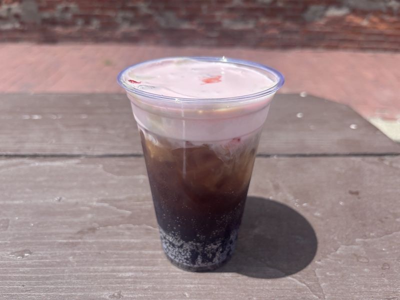 The 'fridge cig,' a beverage of Coca-Cola, espresso, vanilla and cherry cold foam, is among the offerings at Three Dolls and Co., 1008 E. Washington St. July 23, 2026