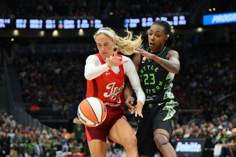 Jul 28, 2026; Seattle, Washington, USA; Indiana Fever guard Sophie Cunningham (8) and Seattle Storm forward Jordan Horston (23) fight for the losse ball during the first half at Climate Pledge Arena.