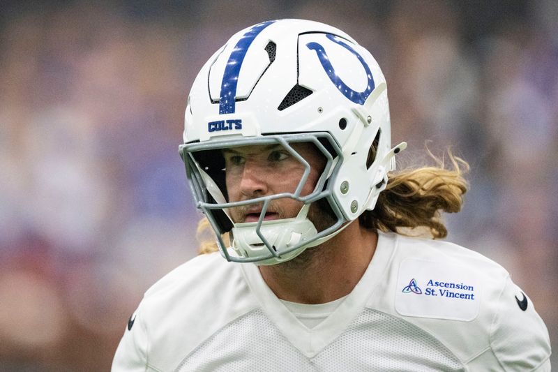 Indianapolis Colts tight end Tyler Warren (84) runs back toward a drill Saturday, Aug. 1, 2026, during day four of Indianapolis Colts training camp at Grand Park in Westfield.