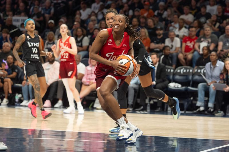 Aug 2, 2026; Minneapolis, Minnesota, USA; Indiana Fever guard Kelsey Mitchell (0) drives to the basket past the defense of Minnesota Lynx forward Napheesa Collier (24) in the fourth quarter at Target Center.