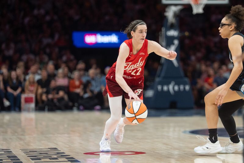 Aug 2, 2026; Minneapolis, Minnesota, USA; Indiana Fever guard Caitlin Clark (22) drives to the basket against Minnesota Lynx guard Olivia Miles (5)  in the fourth quarter at Target Center. Mandatory Credit: Matt Blewett-Imagn Images