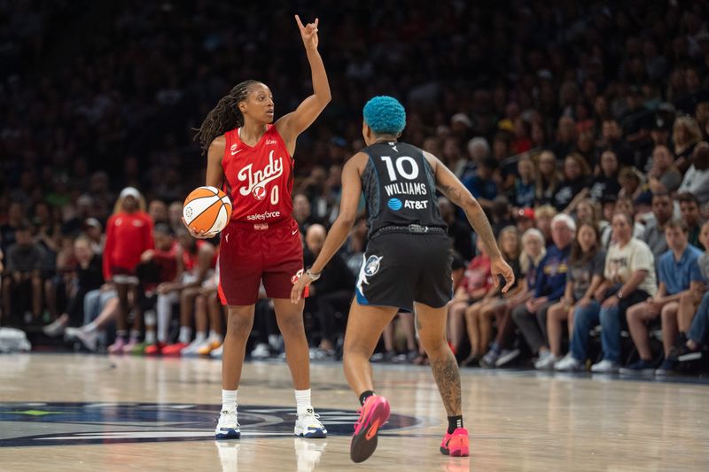 Aug 2, 2026; Minneapolis, Minnesota, USA; Indiana Fever guard Kelsey Mitchell (0) directs the offense as Minnesota Lynx guard Courtney Williams (10) defends in the third quarter at Target Center. Mandatory Credit: Matt Blewett-Imagn Images