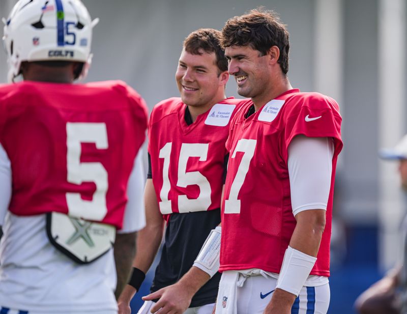 Indianapolis Colts quarterback Daniel Jones (17) laughs while talking to teammates on Monday, Aug. 3, 2026, during practice at Colts Camp at Grand Park in Westfield.