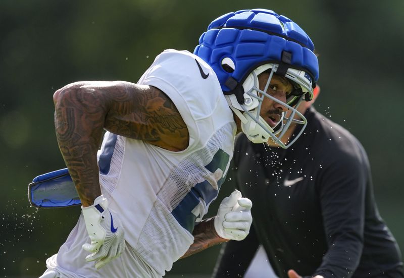 Indianapolis Colts running back Seth McGowan (20) rushes up the field Monday, Aug. 3, 2026, during practice at Colts Camp at Grand Park in Westfield.